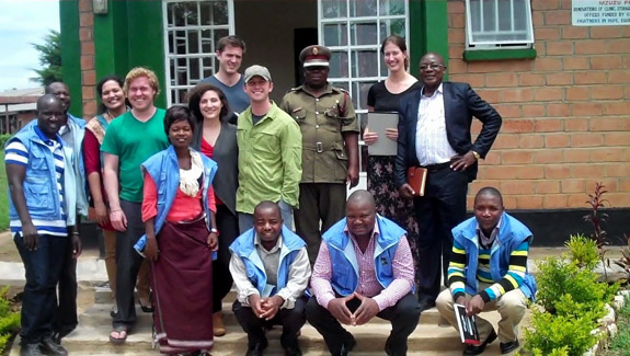 Northwestern Law team with Malawi officials and YOWSO paralegals outside Mzuzu Prison